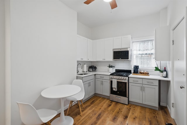 3809 Kennedy Blvd, Union City, NJ 07087 - kitchen featuring stainless steel appliances, backsplash, a sink, and light countertops