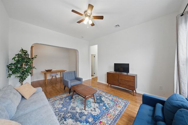3809 Kennedy Blvd, Union City, NJ 07087 - living room featuring wood finished floors, ceiling fan, arched walkways, and baseboards