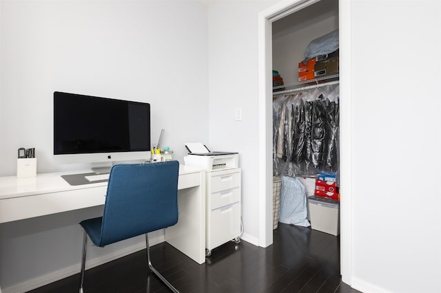 office space featuring dark wood-style flooring and baseboards