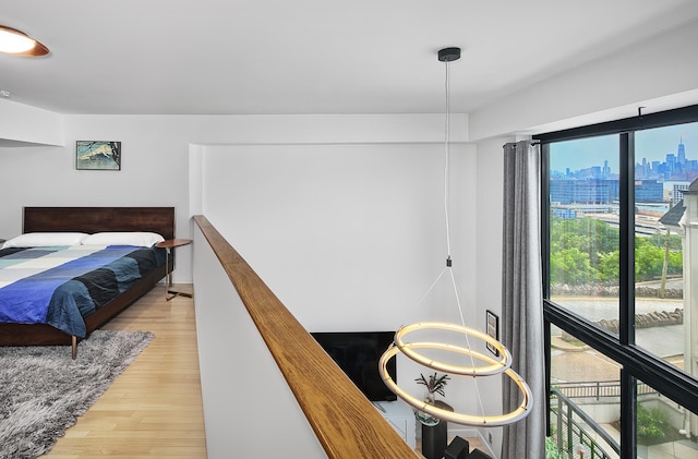518 Gregory Ave Unit A213, Weehawken, NJ 07086 - bedroom with light wood finished floors and a skyline view