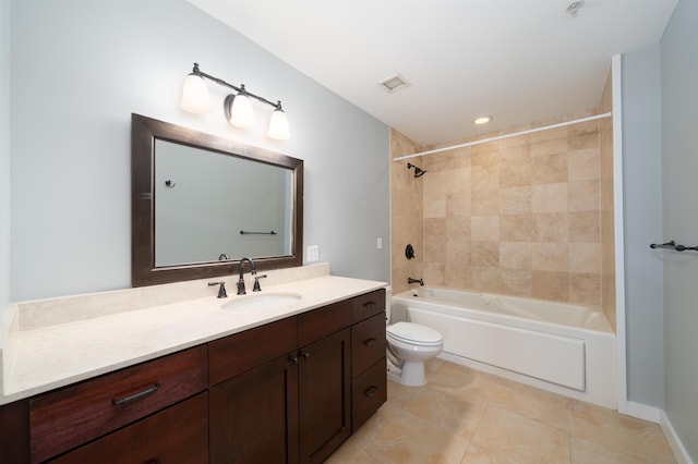 full bathroom with tile patterned floors, vanity, toilet, and tiled shower / bath