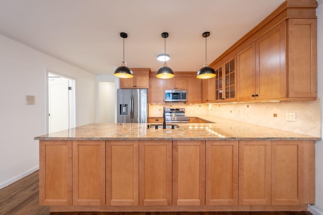 224 Park Ave Unit 1, Hoboken, NJ 07030 - kitchen featuring appliances with stainless steel finishes, a peninsula, backsplash, and dark wood-type flooring