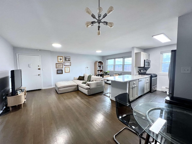 1 Congress St Unit C-4, Jersey City, NJ 07307 - living area with a baseboard radiator, dark wood finished floors, and baseboards