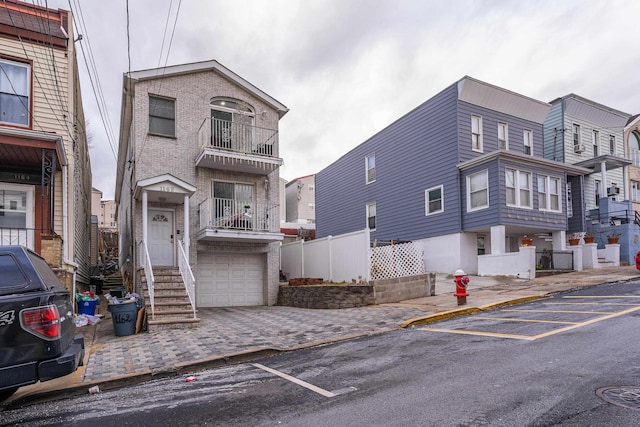 multi unit property featuring a garage