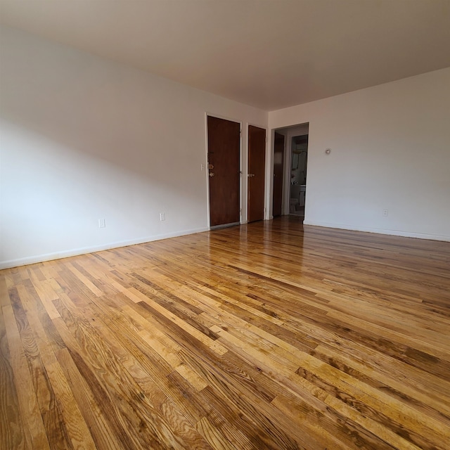 unfurnished room featuring wood-type flooring