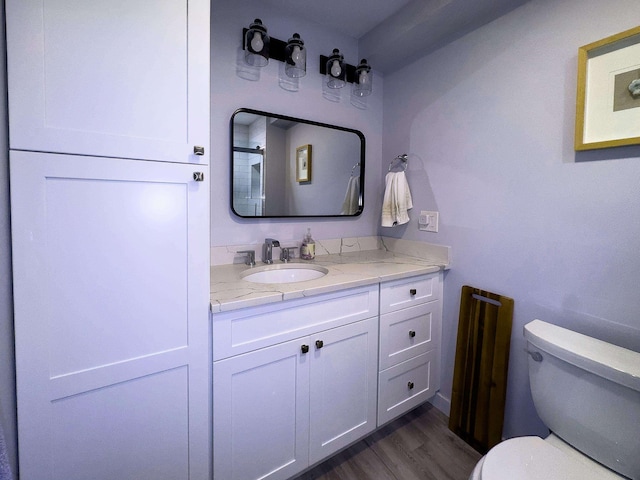 123 Willow Ter, Hoboken, NJ 07030 - bathroom featuring toilet, vanity, and wood finished floors