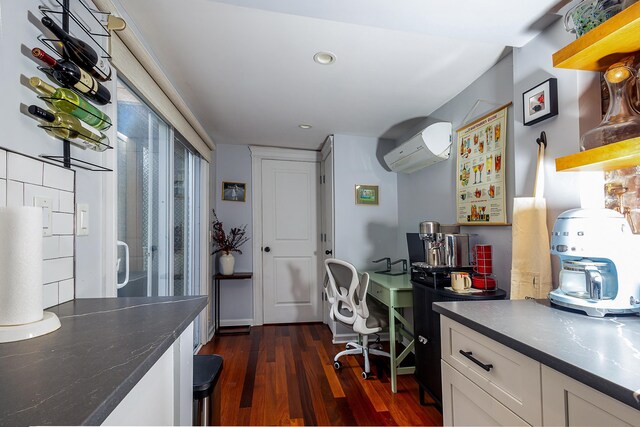 123 Willow Ter, Hoboken, NJ 07030 - office space featuring an AC wall unit, dark wood-style floors, and recessed lighting