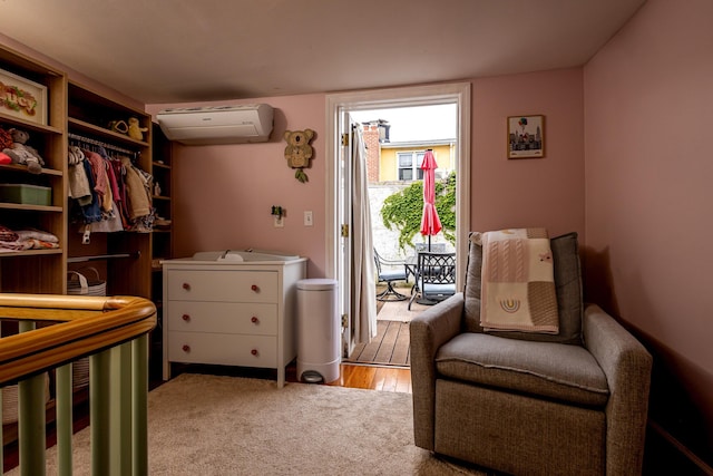 123 Willow Ter, Hoboken, NJ 07030 - bedroom featuring a wall unit AC, access to exterior, and carpet flooring