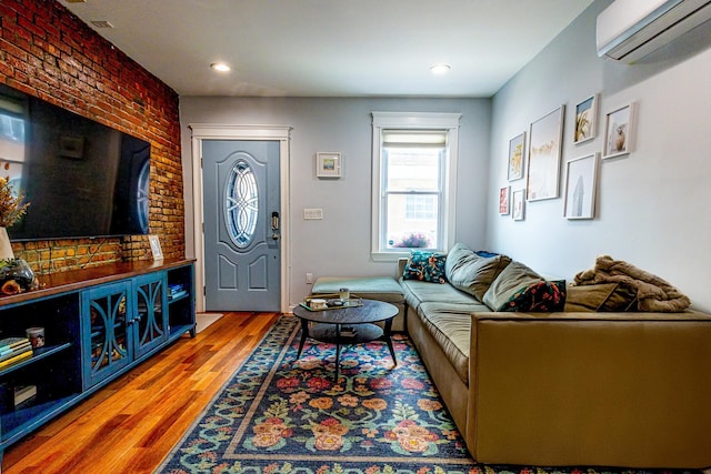 123 Willow Ter, Hoboken, NJ 07030 - living area featuring an AC wall unit, wood finished floors, and recessed lighting