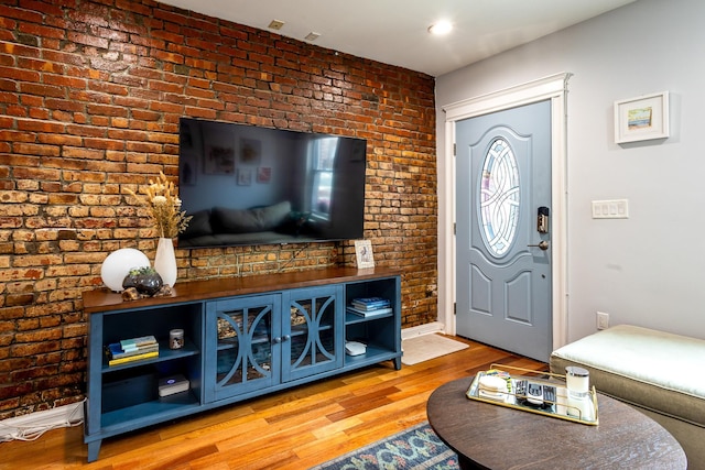 123 Willow Ter, Hoboken, NJ 07030 - living room with brick wall, wood finished floors, and baseboards