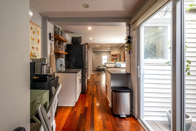 123 Willow Ter, Hoboken, NJ 07030 - kitchen featuring dark countertops, dark wood finished floors, freestanding refrigerator, white cabinets, and recessed lighting