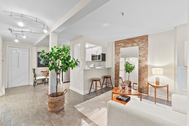 living room featuring rail lighting