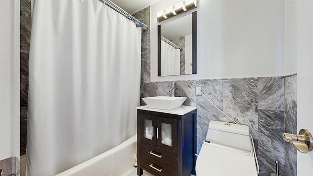 100 Manhattan Ave Unit 1912, Union City, NJ 07087 - full bathroom featuring vanity, toilet, tile walls, and shower / tub combo