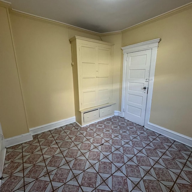 unfurnished room with ornamental molding