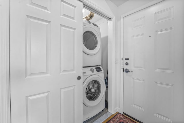 936 Pavonia Ave # 3A, Jersey City, NJ 07306 - laundry area with stacked washer / dryer, tile patterned floors, and laundry area