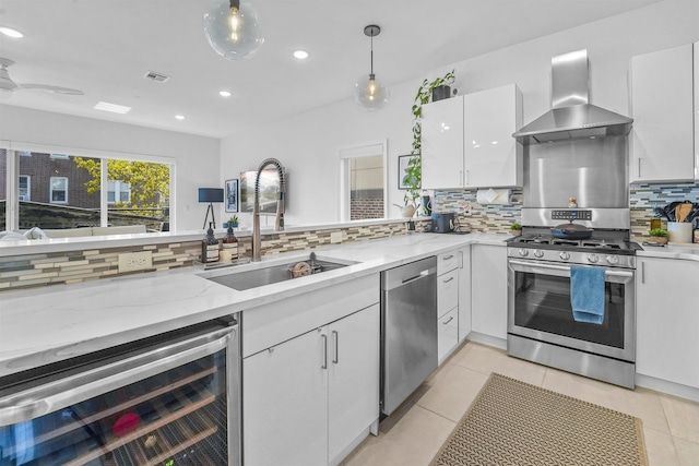 936 Pavonia Ave # 3A, Jersey City, NJ 07306 - kitchen featuring a sink, wine cooler, wall chimney exhaust hood, white cabinets, and appliances with stainless steel finishes