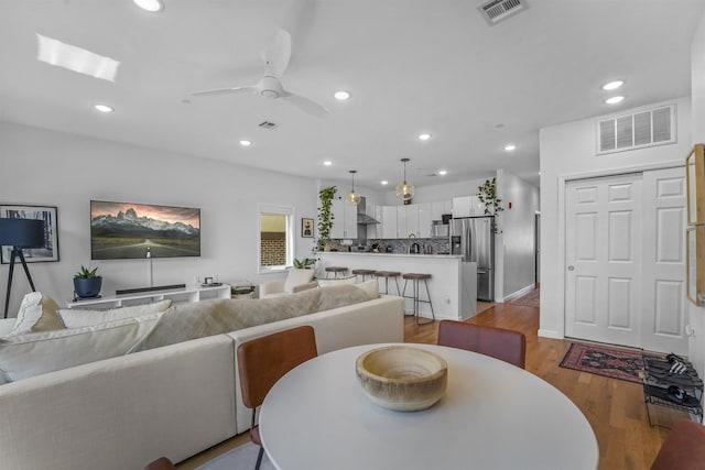 936 Pavonia Ave # 3A, Jersey City, NJ 07306 - dining room with visible vents, a ceiling fan, light wood-style flooring, and recessed lighting