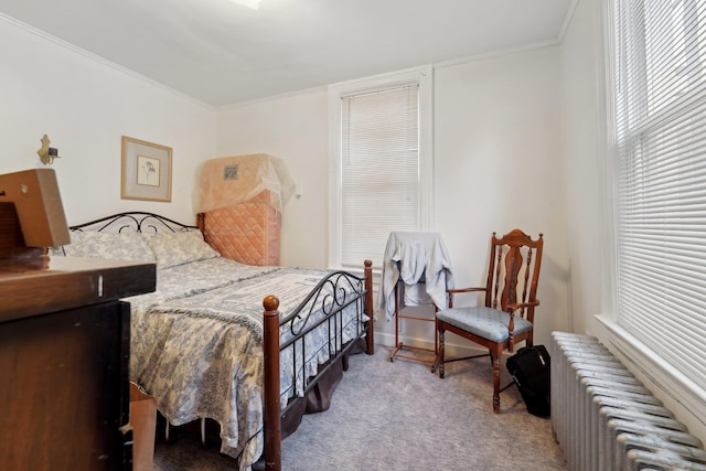 bedroom featuring carpet floors, ornamental molding, and radiator heating unit