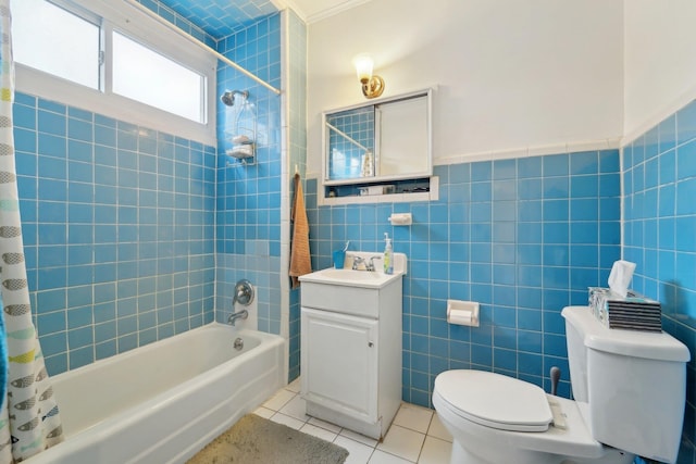 bathroom with tile walls, vanity, tile patterned floors, toilet, and shower / bathtub combination with curtain