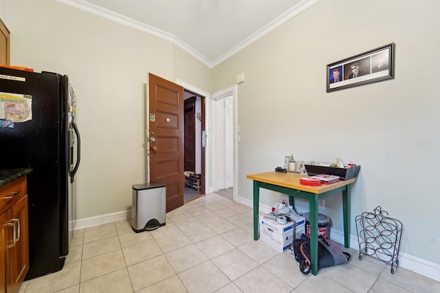 home office featuring crown molding, baseboards, and light tile patterned floors
