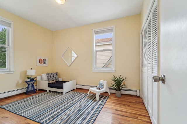 37 47th St, Weehawken, NJ 07086 - sitting room with light wood-style floors and baseboard heating