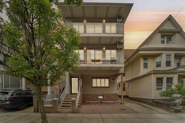 37 47th St, Weehawken, NJ 07086 - view of front of property featuring a balcony, crawl space, and stucco siding