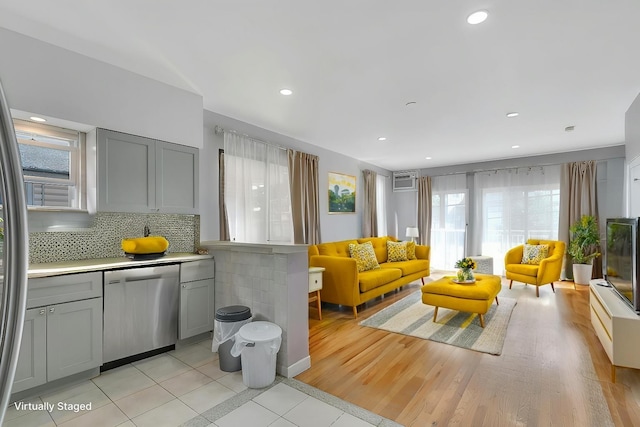 living room featuring light tile patterned flooring and recessed lighting
