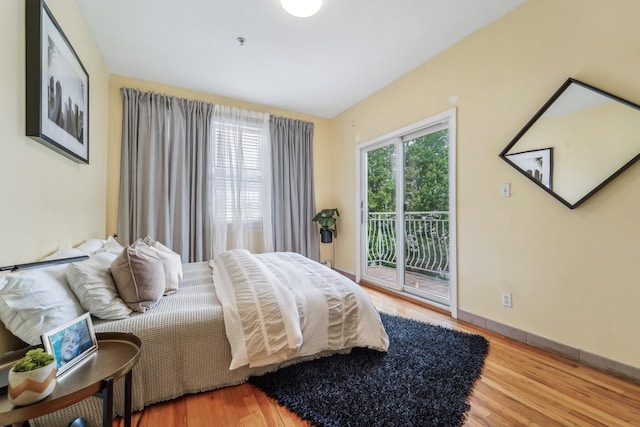37 47th St, Weehawken, NJ 07086 - bedroom featuring access to outside, wood finished floors, and baseboards