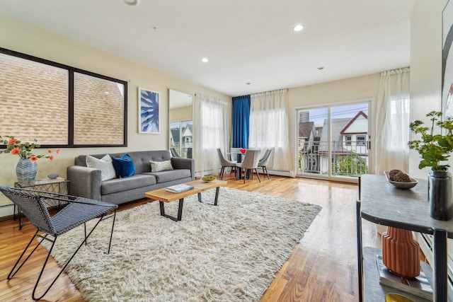 37 47th St, Weehawken, NJ 07086 - living area with healthy amount of natural light, wood finished floors, and recessed lighting
