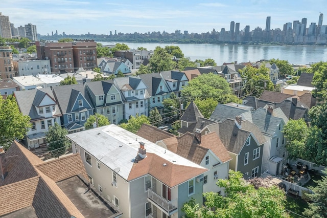 drone / aerial view with a water view and a view of city