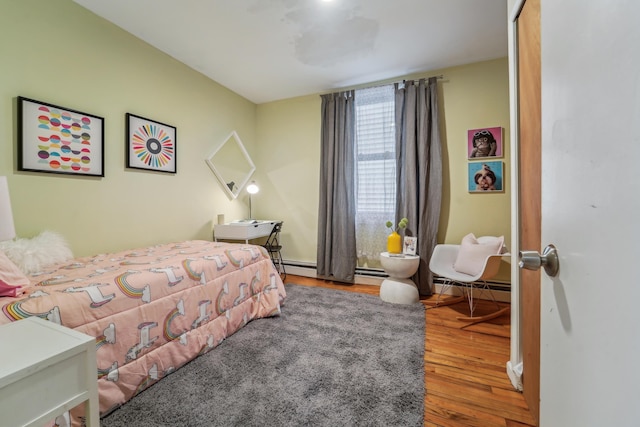 37 47th St, Weehawken, NJ 07086 - bedroom featuring wood finished floors and a baseboard radiator