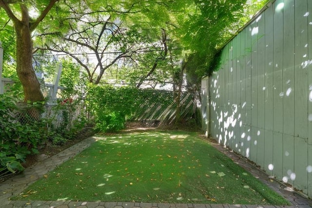 view of yard with fence