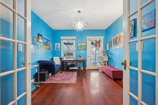 office space with french doors, a chandelier, and dark hardwood / wood-style floors