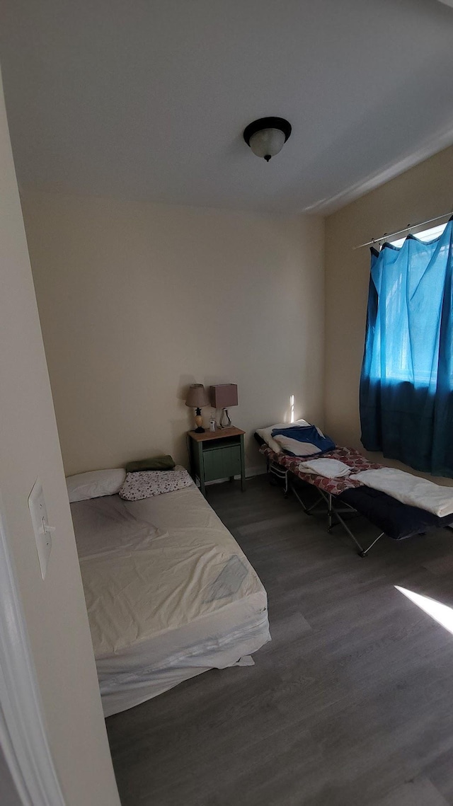 bedroom with wood finished floors