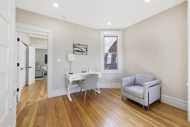 office area featuring recessed lighting, baseboards, and light wood finished floors