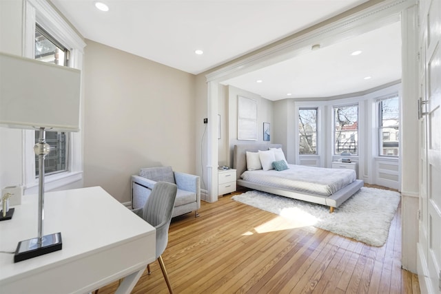 bedroom with recessed lighting and light wood-style floors