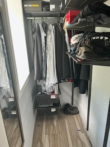 spacious closet featuring hardwood / wood-style floors