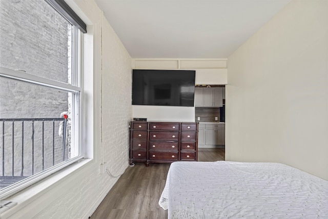 bedroom featuring dark wood finished floors