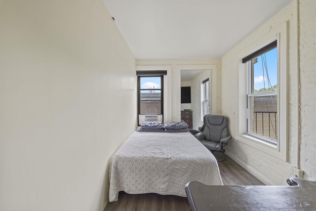 bedroom featuring wood finished floors