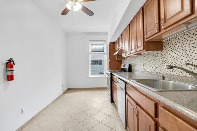 123 Shippen St, Weehawken, NJ 07086 - kitchen with stainless steel appliances, ceiling fan, backsplash, light tile patterned flooring, and brown cabinetry