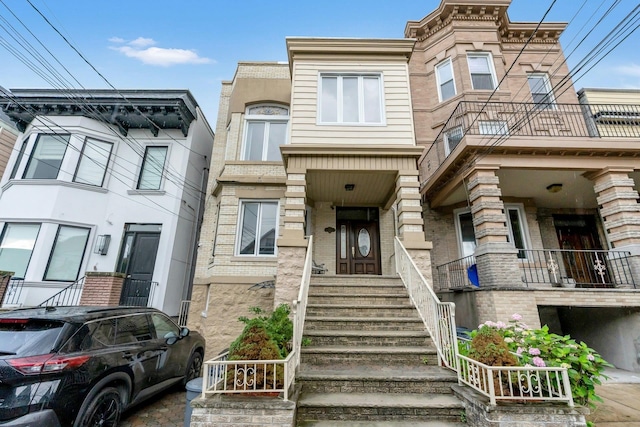 123 Shippen St, Weehawken, NJ 07086 - view of property with brick siding and stairway