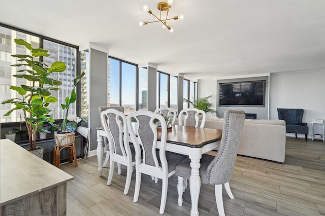 200 Winston Dr Unit 803, Cliffside Park, NJ 07010 - dining area featuring a chandelier and light wood finished floors