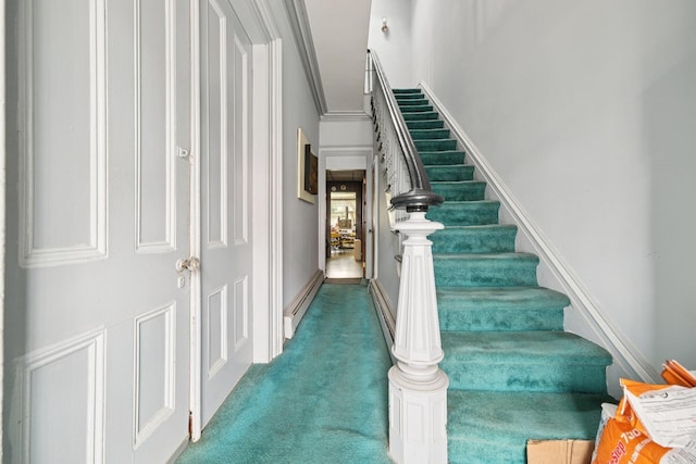 81 Atlantic St, Jersey City, NJ 07304 - stairway with carpet floors, a baseboard heating unit, and ornamental molding