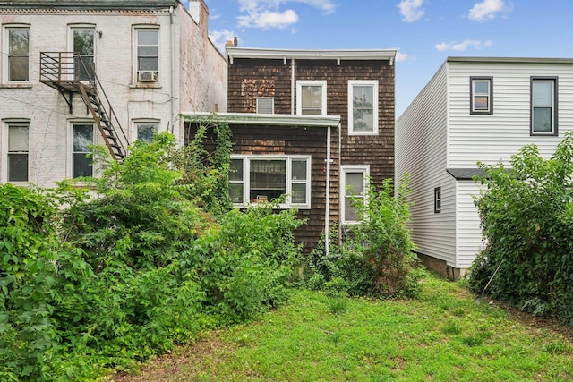81 Atlantic St, Jersey City, NJ 07304 - rear view of property with cooling unit and a lawn