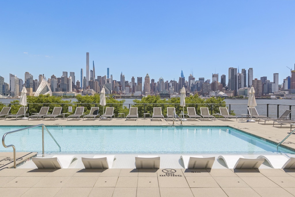 1200 Avenue At Port Imperial Unit 514, Weehawken, NJ 07086 - community pool with a view of skyline and a patio