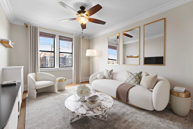 living room featuring crown molding, ceiling fan, and a wealth of natural light