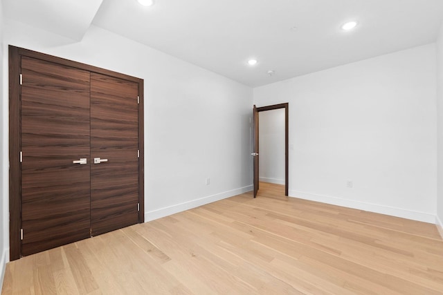 unfurnished bedroom with light hardwood / wood-style floors