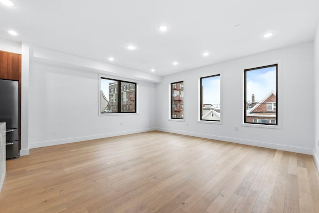 unfurnished living room with light wood-type flooring