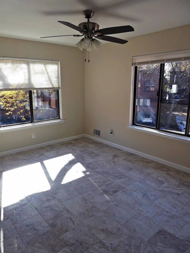 spare room featuring ceiling fan