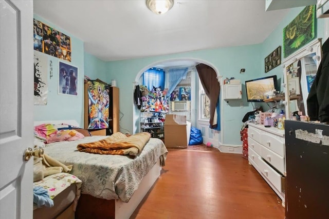 bedroom with hardwood / wood-style flooring